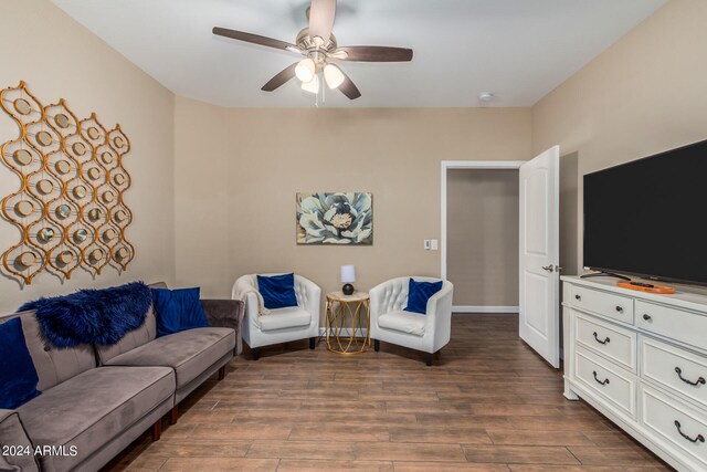 living room featuring hardwood / wood-style flooring and ceiling fan