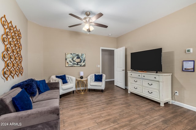 living room with hardwood / wood-style floors and ceiling fan