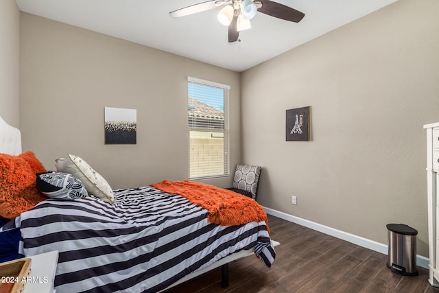 bedroom with ceiling fan and dark hardwood / wood-style flooring