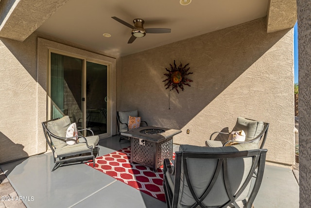 view of patio / terrace featuring a fire pit and ceiling fan