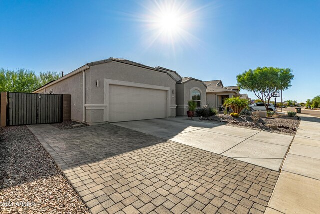 ranch-style home featuring a garage