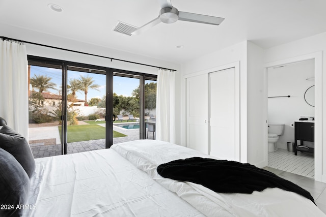 tiled bedroom featuring ceiling fan, a closet, ensuite bath, visible vents, and access to exterior