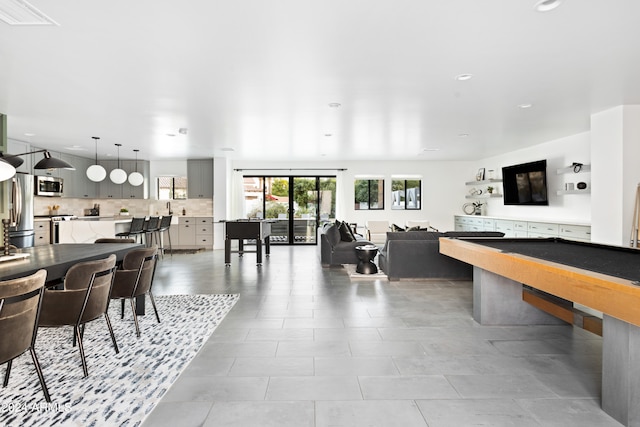 game room with light tile patterned floors