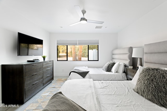 bedroom with ceiling fan, baseboards, and visible vents