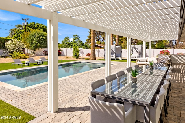 view of swimming pool with an outdoor living space, a pergola, and a patio area