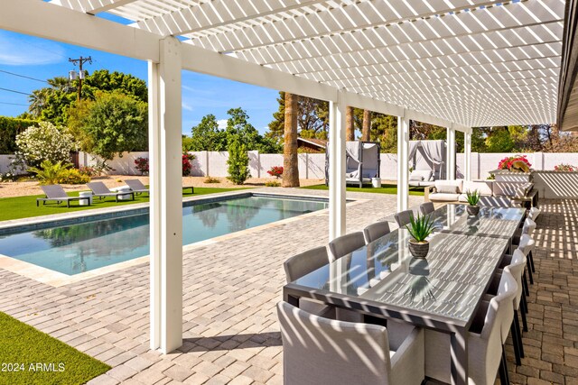 view of swimming pool featuring a patio, a fenced backyard, and a pergola