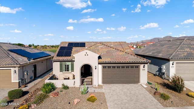 view of front of house featuring solar panels