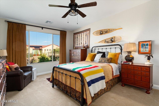 bedroom with light colored carpet and ceiling fan