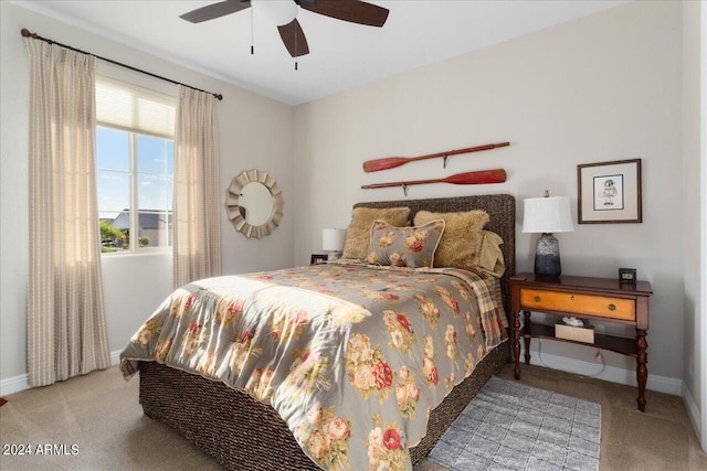 bedroom with light colored carpet and ceiling fan