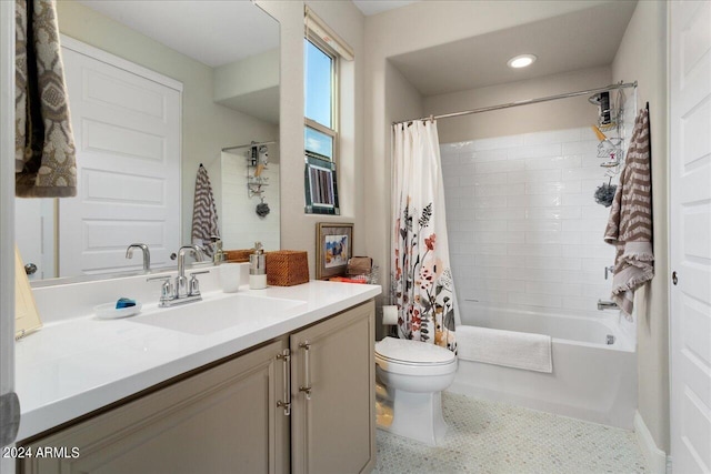 full bathroom featuring vanity, toilet, and shower / tub combo with curtain