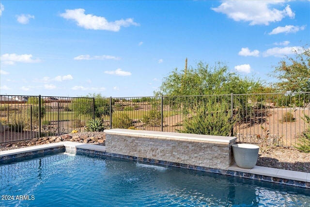 view of pool featuring pool water feature