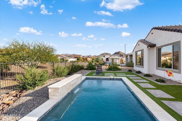 view of swimming pool featuring pool water feature