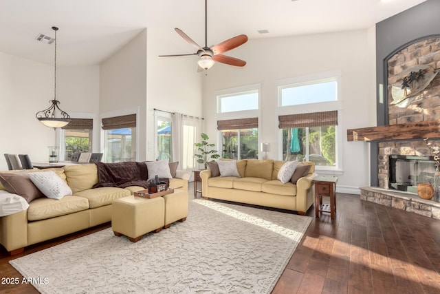 2058 E Marlene Dr, Gilbert, AZ 85296 - living room with a high ceiling, dark wood-style floors, a fireplace, and a ceiling fan