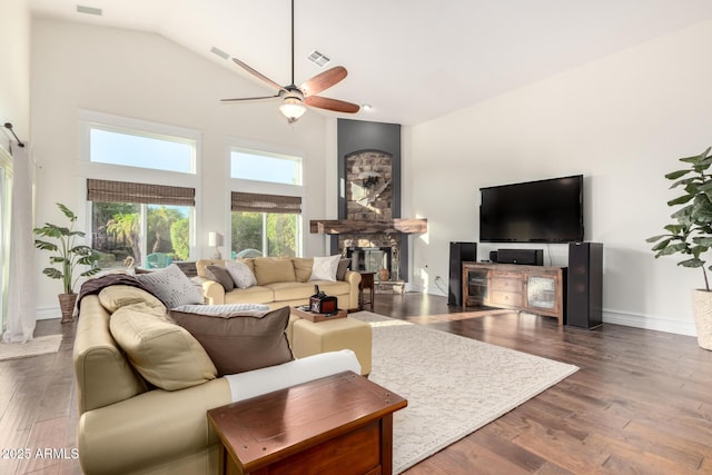 2058 E Marlene Dr, Gilbert, AZ 85296 - living area with high vaulted ceiling, a ceiling fan, a glass covered fireplace, and dark wood-type flooring