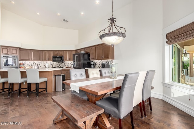 2058 E Marlene Dr, Gilbert, AZ 85296 - dining area featuring high vaulted ceiling, dark wood-type flooring, and recessed lighting