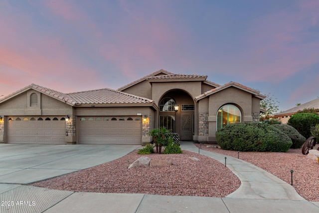 2058 E Marlene Dr, Gilbert, AZ 85296 - mediterranean / spanish-style house with stucco siding, an attached garage, driveway, and a tiled roof