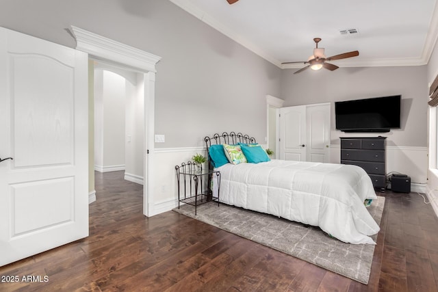 2058 E Marlene Dr, Gilbert, AZ 85296 - bedroom with crown molding, wood-type flooring, arched walkways, a ceiling fan, and a closet
