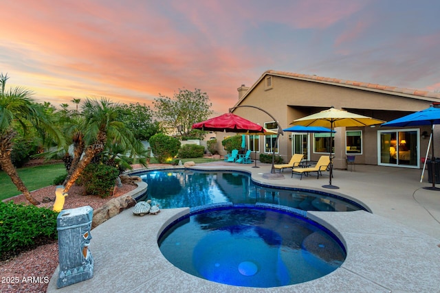 2058 E Marlene Dr, Gilbert, AZ 85296 - pool at dusk featuring a patio area and a pool with connected hot tub