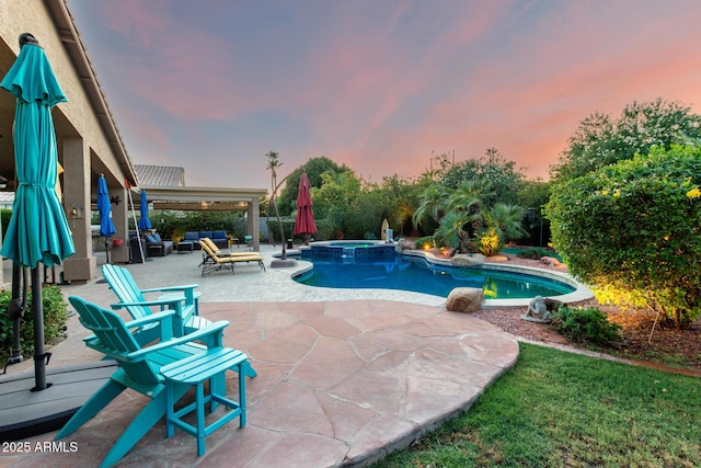 2058 E Marlene Dr, Gilbert, AZ 85296 - pool at dusk with a patio, a pool with connected hot tub, and an outdoor hangout area