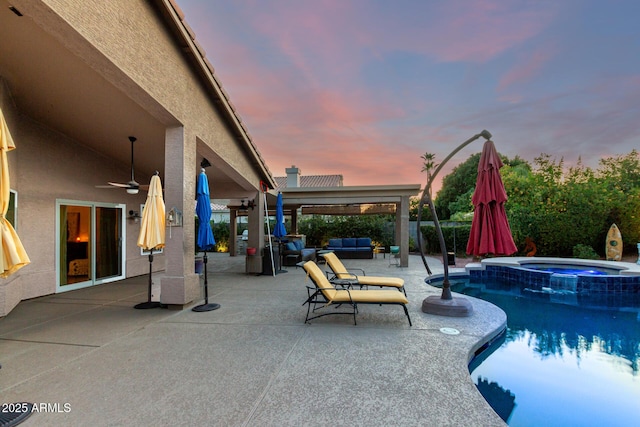 2058 E Marlene Dr, Gilbert, AZ 85296 - pool at dusk featuring a ceiling fan, outdoor lounge area, a patio area, and a pool with connected hot tub