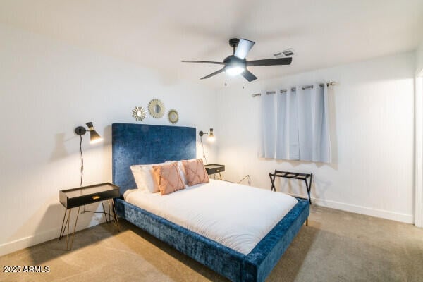 carpeted bedroom with ceiling fan