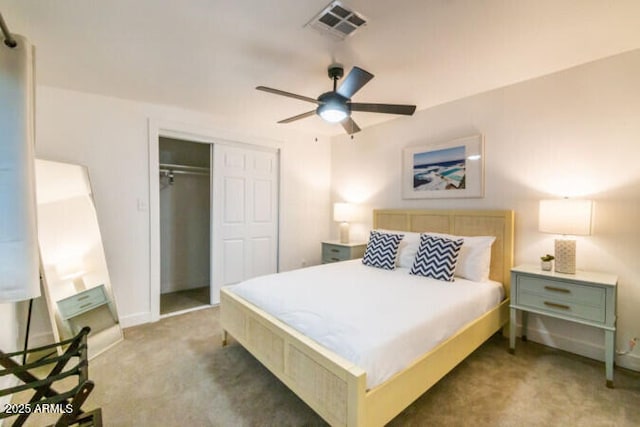 bedroom featuring ceiling fan, light carpet, and a closet