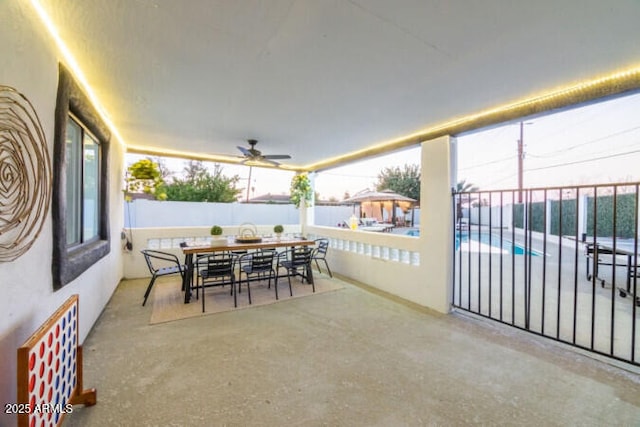 view of patio / terrace with a fenced in pool