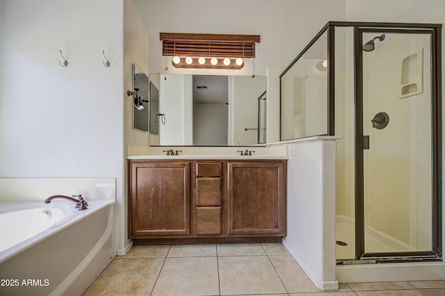 full bathroom with tile patterned floors, a stall shower, and a garden tub