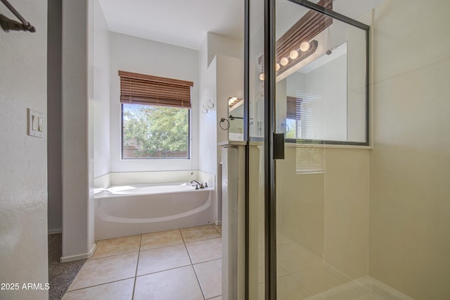 full bath with an enclosed shower, tile patterned flooring, and a garden tub