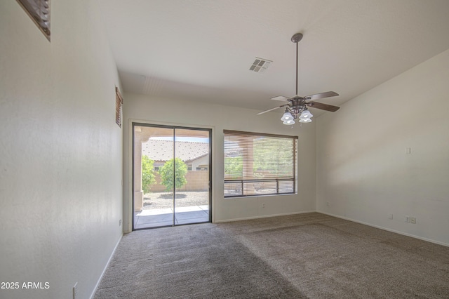 spare room with baseboards, a ceiling fan, carpet flooring, and visible vents