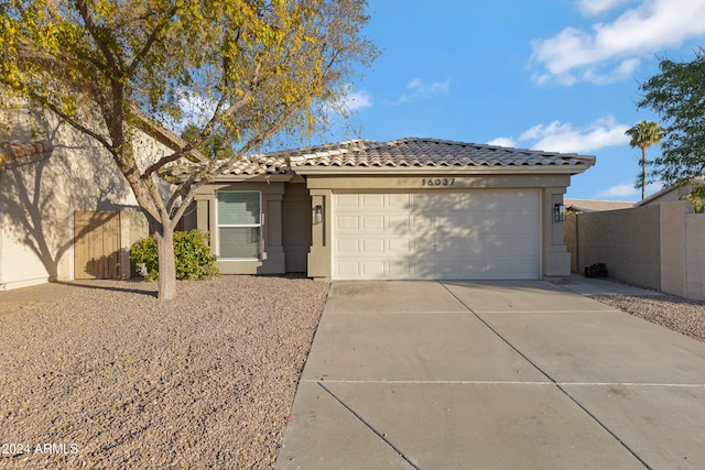 single story home featuring a garage