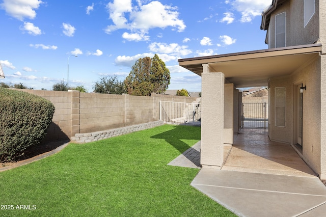 view of yard with a fenced backyard