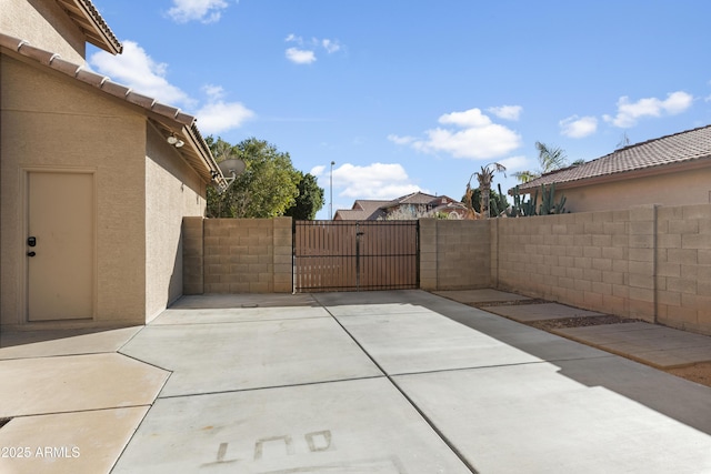 view of patio / terrace featuring a gate and fence