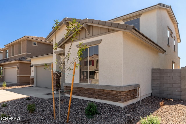 view of property exterior featuring a garage