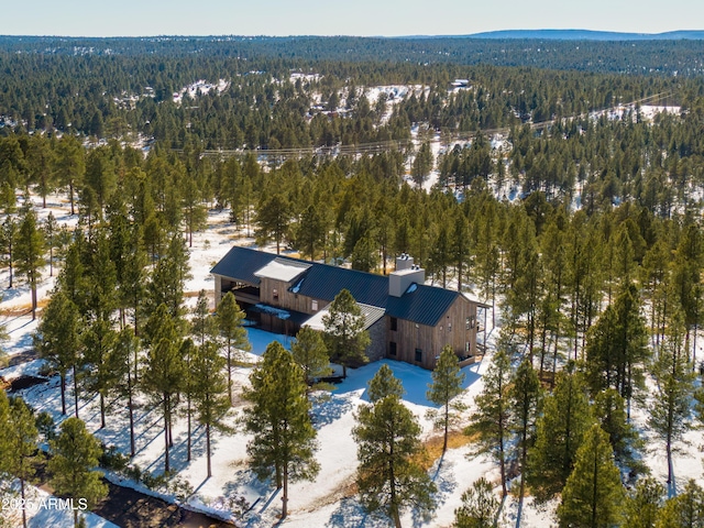 birds eye view of property with a view of trees