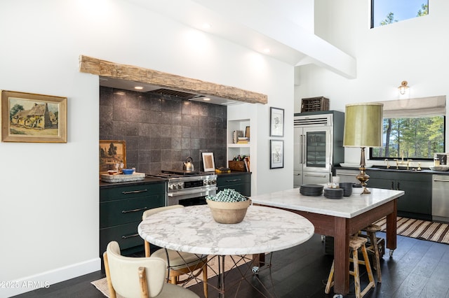 kitchen with stainless steel gas range oven, dishwasher, tasteful backsplash, and dark wood-style flooring