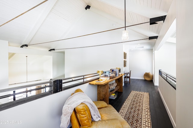 kitchen with beam ceiling, hardwood / wood-style flooring, baseboards, and high vaulted ceiling