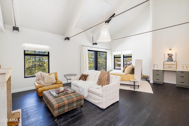 living room with hardwood / wood-style floors, baseboards, high vaulted ceiling, beam ceiling, and a fireplace with raised hearth