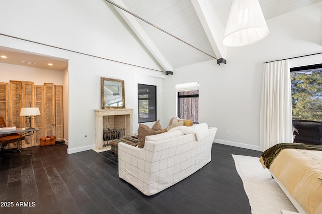 living area featuring beamed ceiling, a healthy amount of sunlight, high vaulted ceiling, and dark wood-style flooring