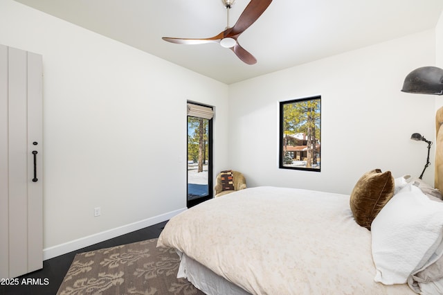 bedroom featuring a ceiling fan, baseboards, and access to outside