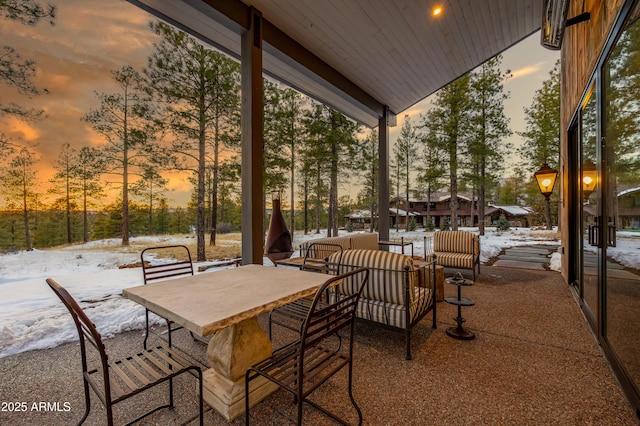 patio terrace at dusk with outdoor dining area