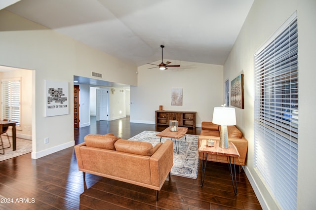 living room with ceiling fan, dark wood-type flooring, and lofted ceiling