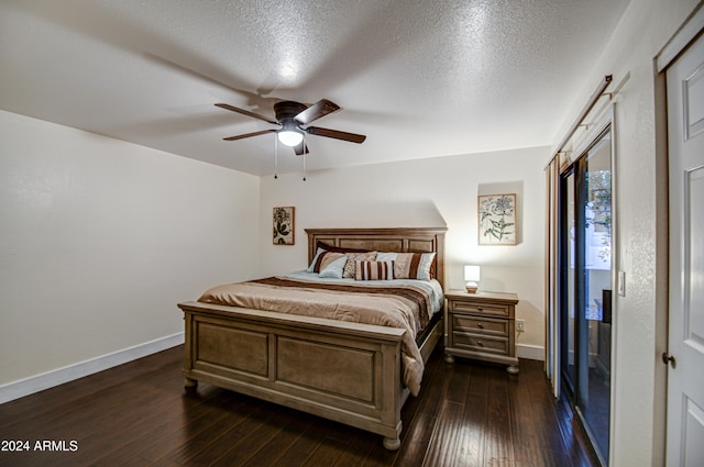 bedroom featuring a textured ceiling, dark hardwood / wood-style flooring, and ceiling fan