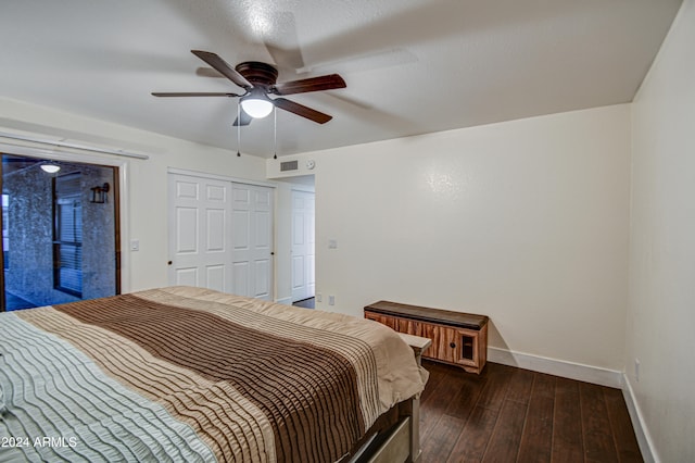 bedroom with a closet, ceiling fan, and dark wood-type flooring