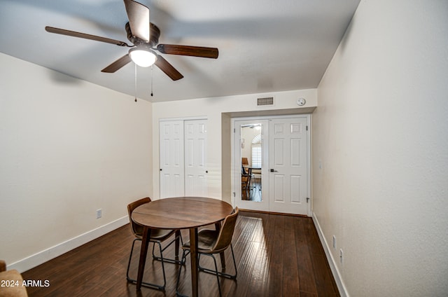 dining space featuring dark hardwood / wood-style flooring and ceiling fan