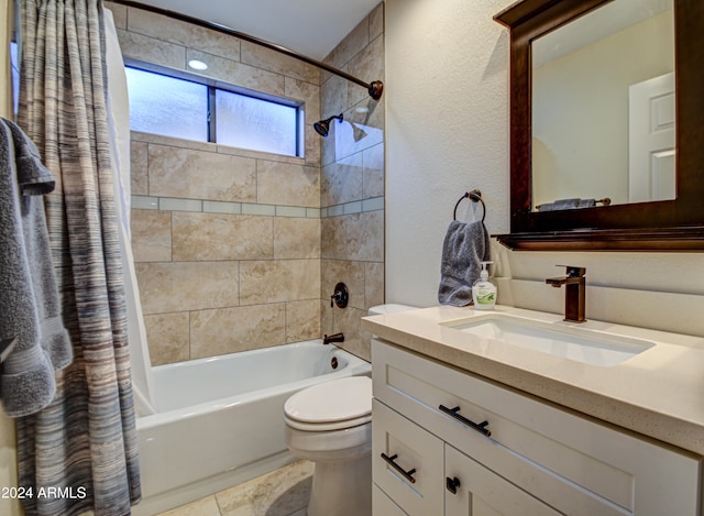 full bathroom with toilet, tile patterned floors, vanity, and shower / tub combo with curtain