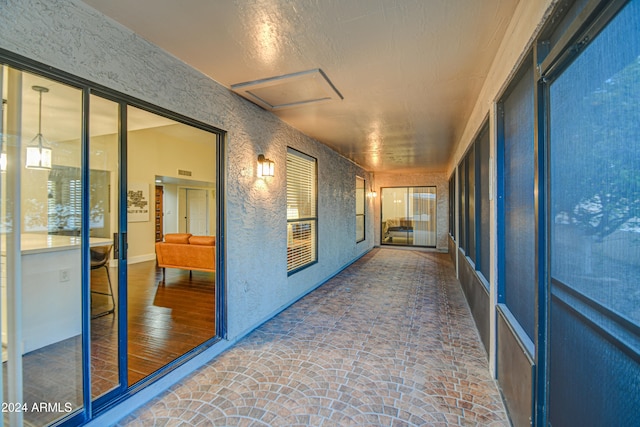 corridor with dark hardwood / wood-style flooring