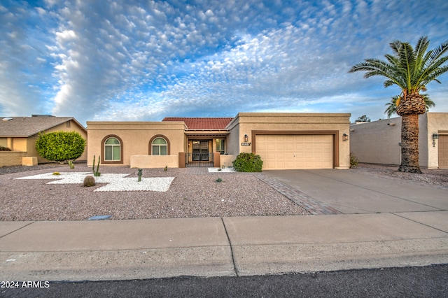 view of front of property with a garage