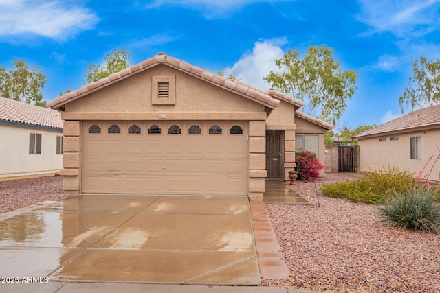 ranch-style house with stucco siding, concrete driveway, a garage, an outdoor structure, and a tiled roof