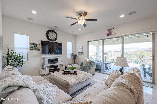 tiled living room with ceiling fan